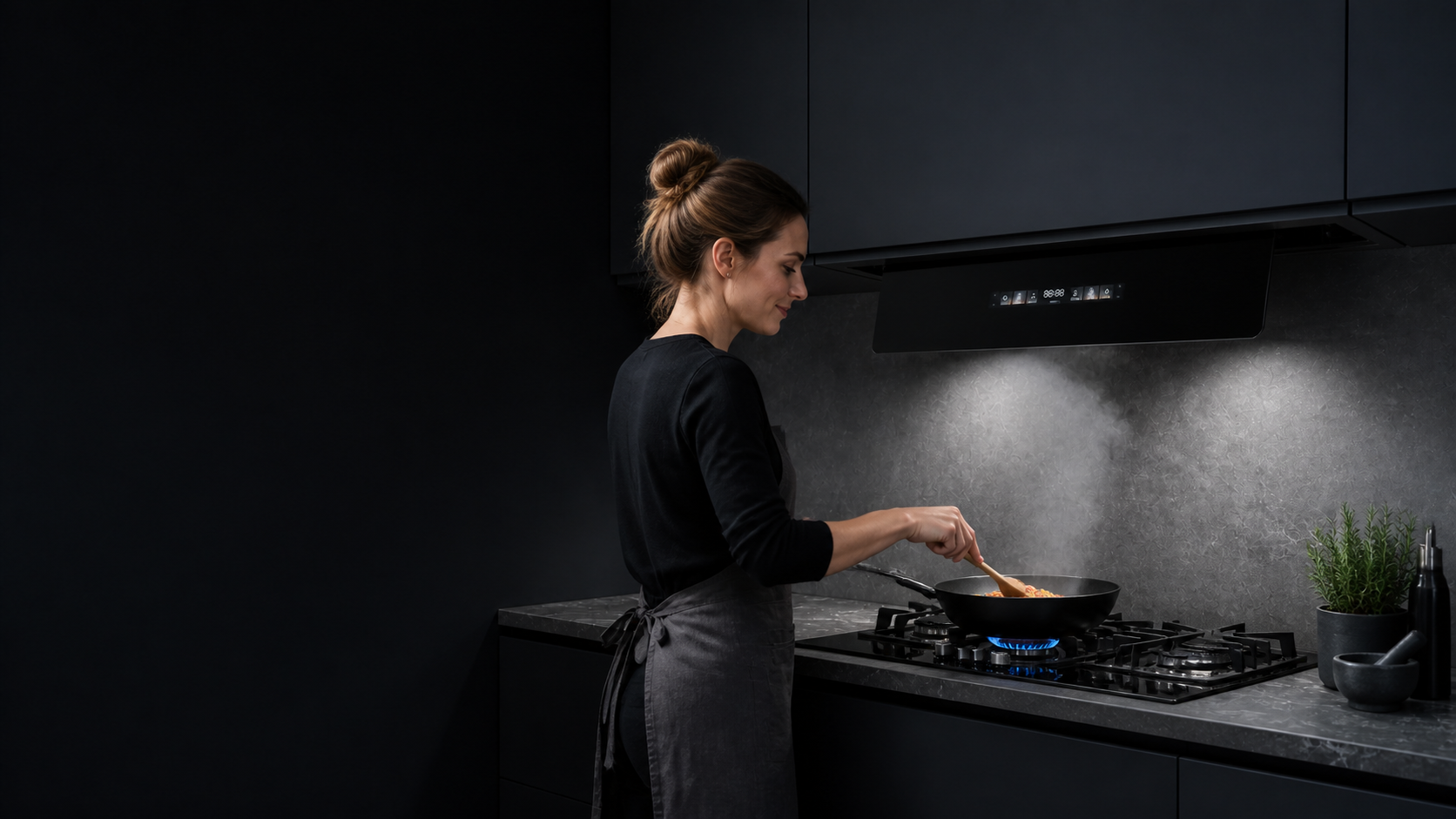 Adult woman cooking over a blue-flame gas stove beneath a concealed SUNDEAR F9-60 built-in range hood
